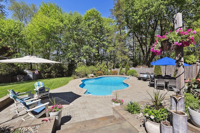 view of pool with a yard, a patio, a fenced in pool, and a fenced backyard