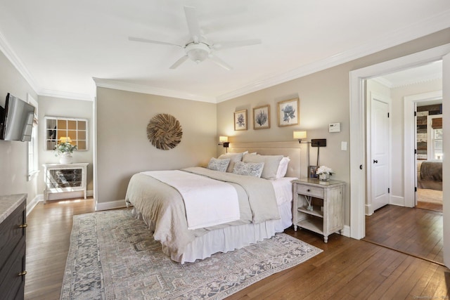 bedroom featuring baseboards, ornamental molding, dark wood finished floors, and ceiling fan