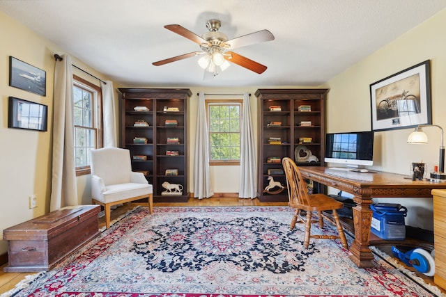 office featuring a ceiling fan and wood finished floors