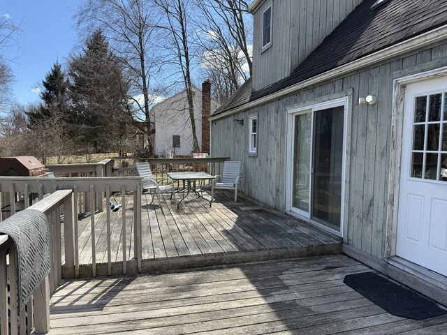 wooden terrace with area for grilling