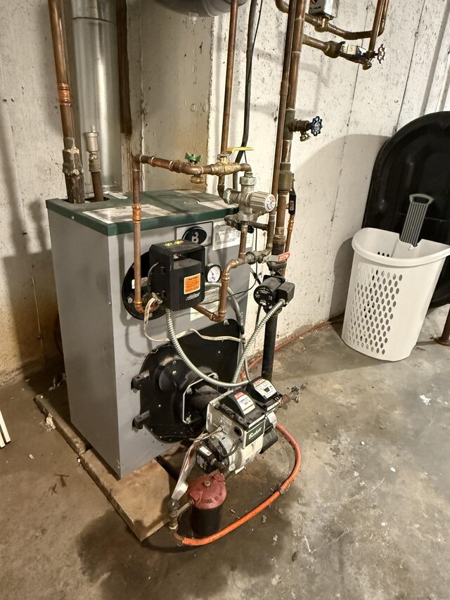utility room featuring a heating unit
