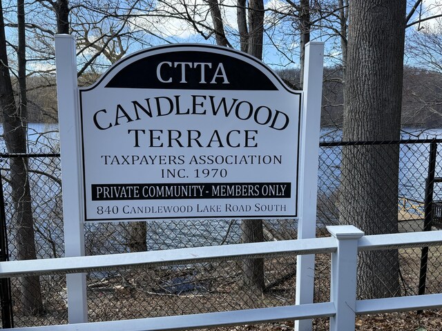 community sign with fence