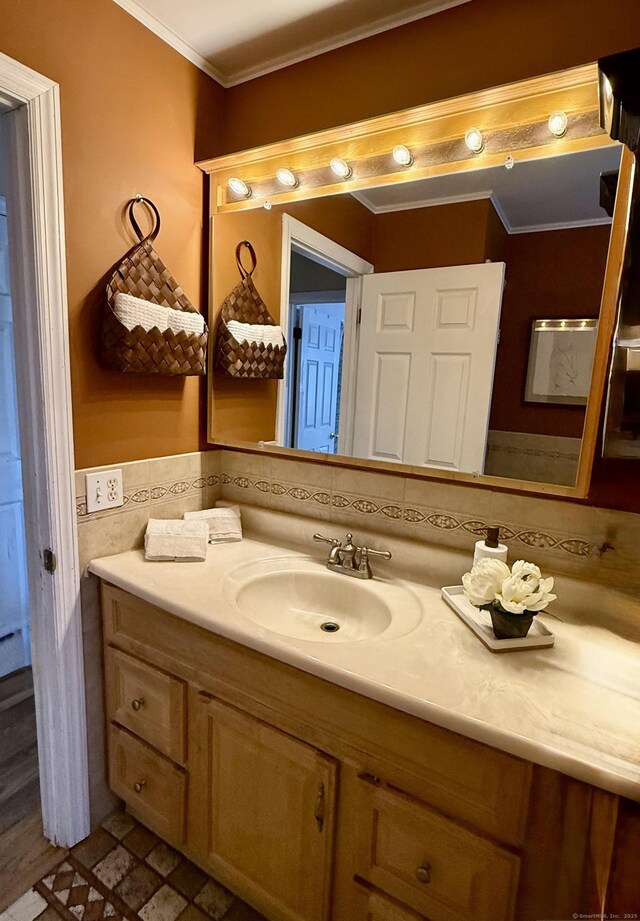 bathroom with vanity and crown molding