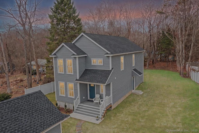 58 Killingworth Tpke, Clinton, CT 06413 - view of front of house featuring fence, roof with shingles, and a front yard