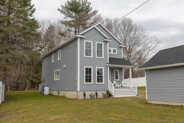 58 Killingworth Tpke, Clinton, CT 06413 - back of property with a lawn and fence