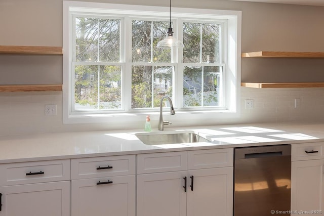 58 Killingworth Tpke, Clinton, CT 06413 - kitchen with a sink, open shelves, dishwasher, white cabinets, and a healthy amount of sunlight