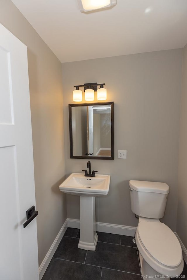 58 Killingworth Tpke, Clinton, CT 06413 - bathroom with tile patterned floors, toilet, and baseboards