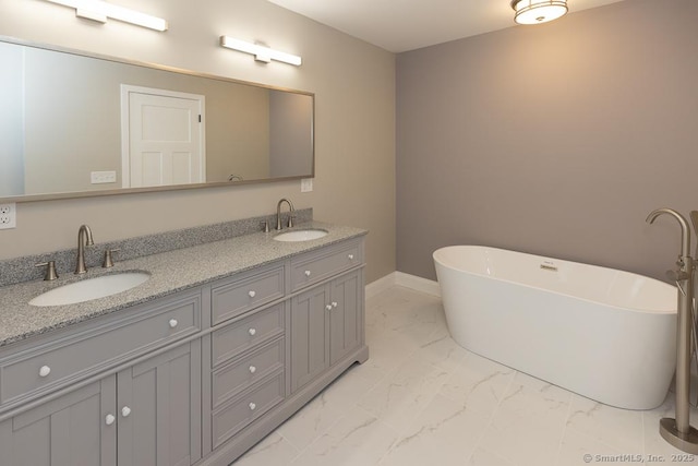 58 Killingworth Tpke, Clinton, CT 06413 - full bathroom featuring marble finish floor, a freestanding tub, and a sink