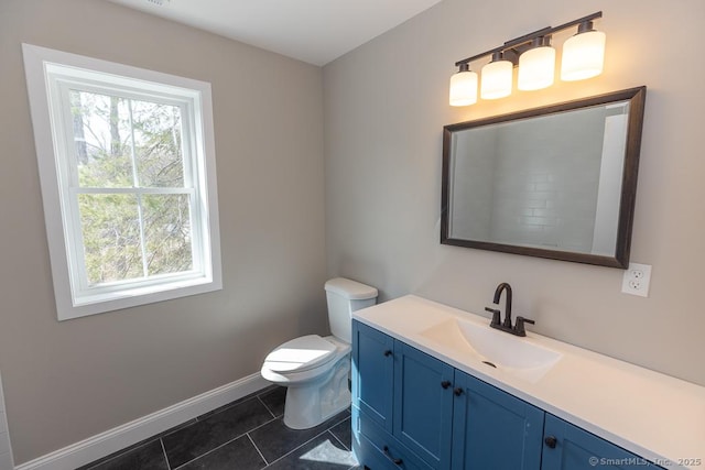 58 Killingworth Tpke, Clinton, CT 06413 - bathroom featuring tile patterned floors, vanity, toilet, and baseboards
