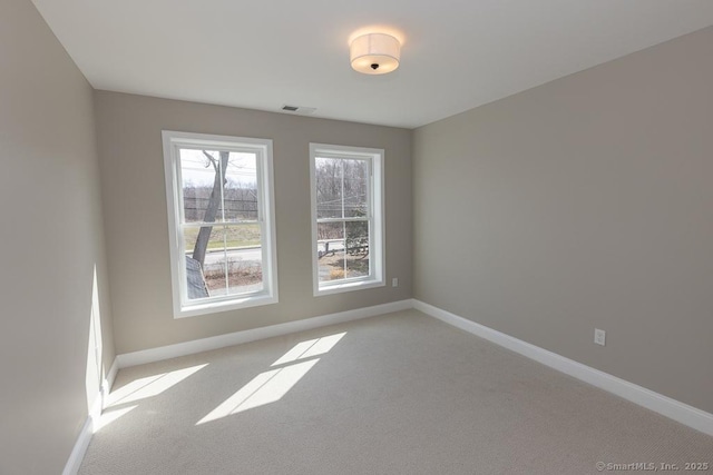 58 Killingworth Tpke, Clinton, CT 06413 - unfurnished room featuring light colored carpet, visible vents, and baseboards