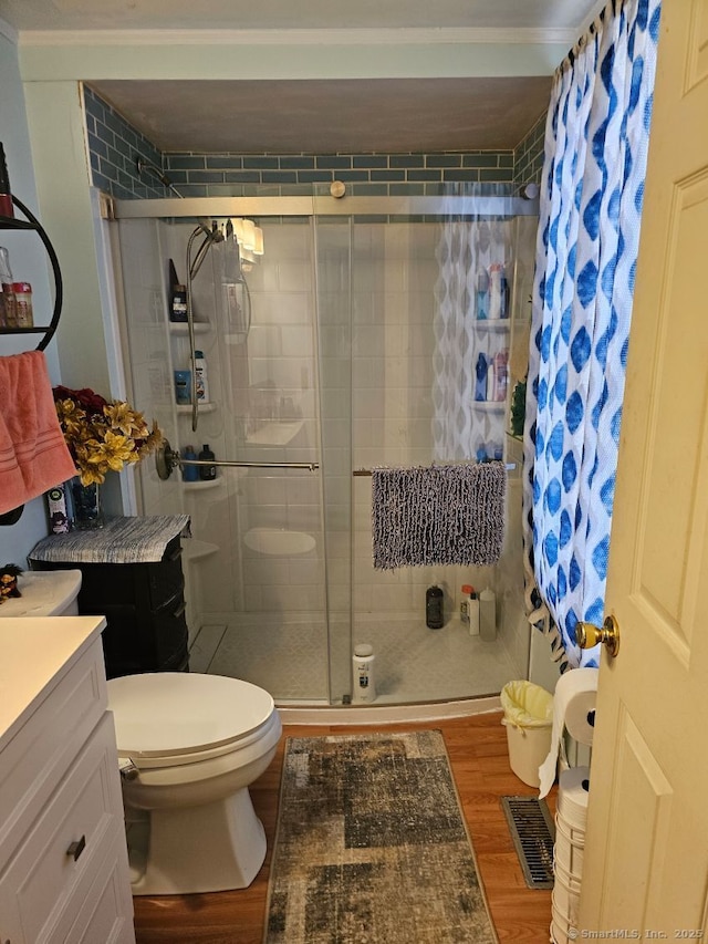 125 Mckinley Ave, Norwich, CT 06360 - full bathroom with visible vents, wood finished floors, a shower stall, and toilet