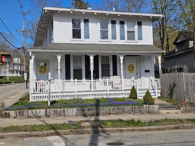 125 Mckinley Ave, Norwich, CT 06360 - view of front of property featuring fence, a porch, and roof with shingles