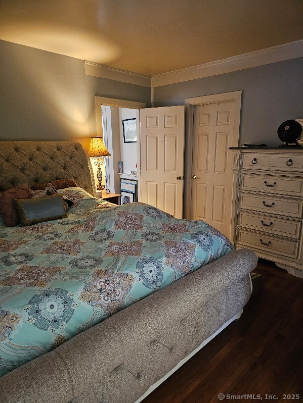 125 Mckinley Ave, Norwich, CT 06360 - bedroom with wood finished floors and crown molding