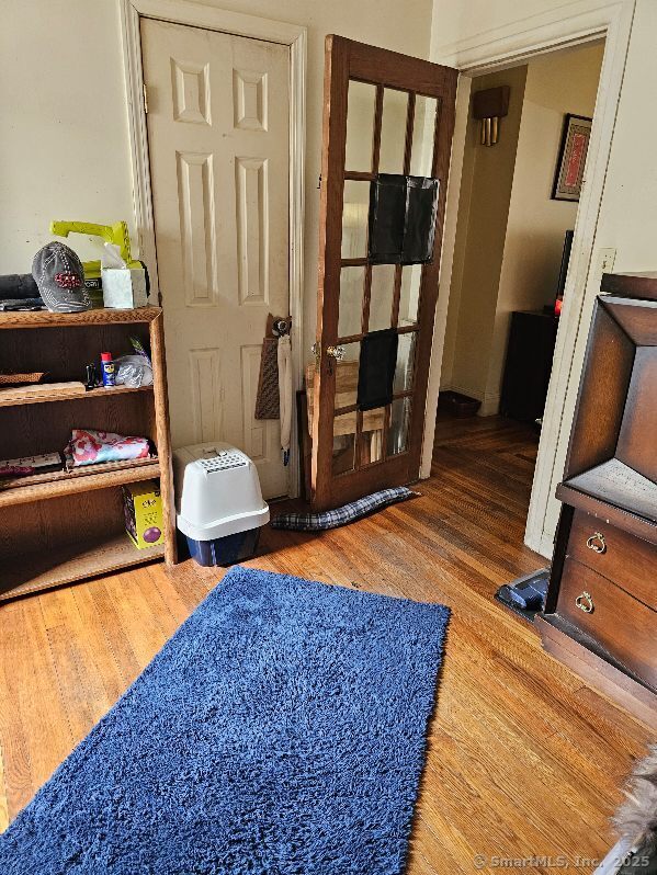 125 Mckinley Ave, Norwich, CT 06360 - bedroom with wood finished floors