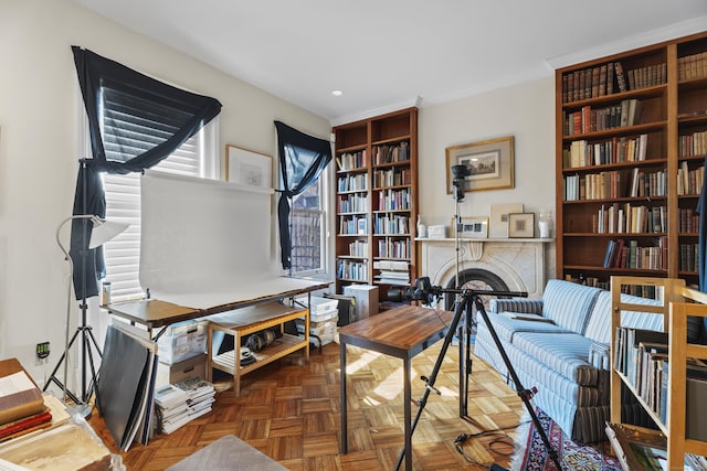 home office featuring recessed lighting, crown molding, and a fireplace