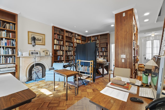 living area with built in features, wall of books, recessed lighting, and crown molding