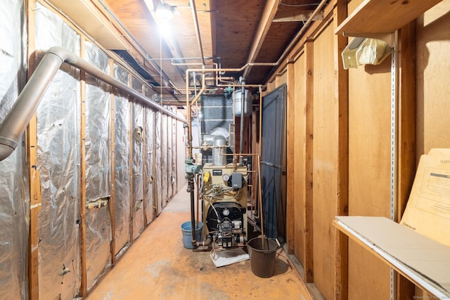 unfinished basement featuring a heating unit