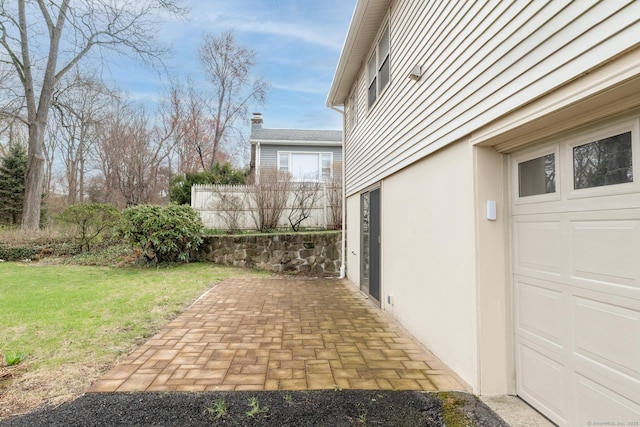 view of yard with a patio and a garage