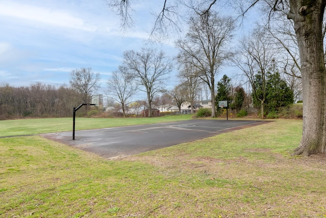 view of basketball court featuring a yard and community basketball court