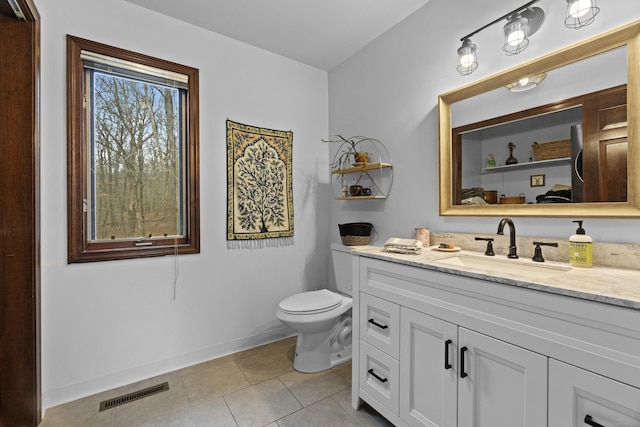 bathroom with visible vents, tile patterned flooring, baseboards, vanity, and toilet