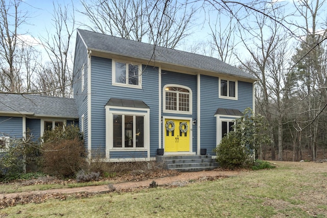 view of front of home with a front lawn