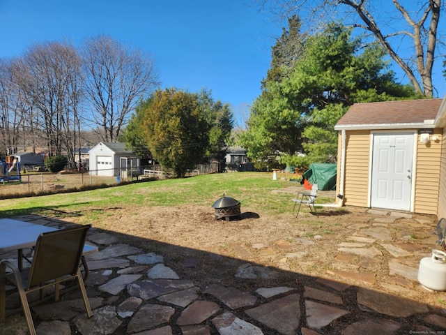 27 Payne Pl, Meriden, CT 06450 - view of yard with a fire pit, a patio area, an outdoor structure, and outdoor dining space