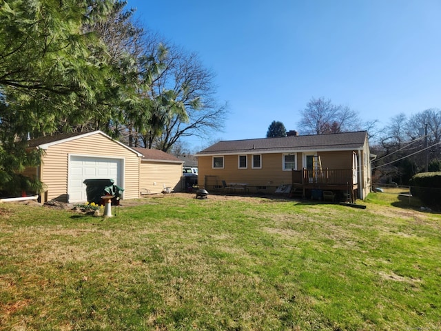 27 Payne Pl, Meriden, CT 06450 - view of grassy yard featuring an outbuilding, a garage, and a deck