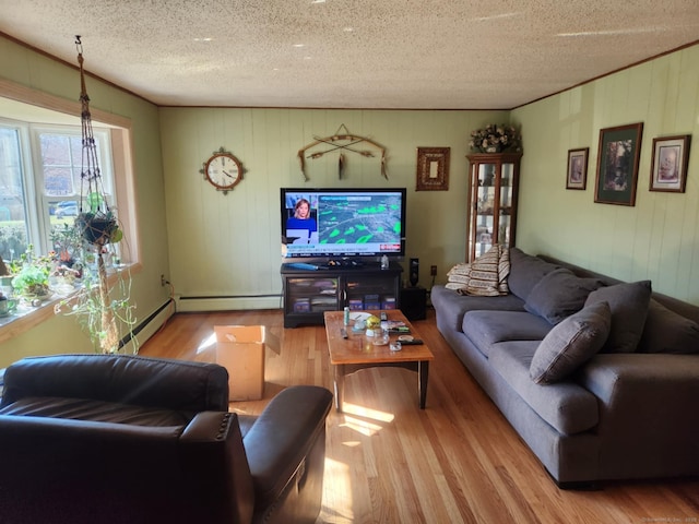 27 Payne Pl, Meriden, CT 06450 - living area featuring a baseboard radiator, wood finished floors, a textured ceiling, and wood walls