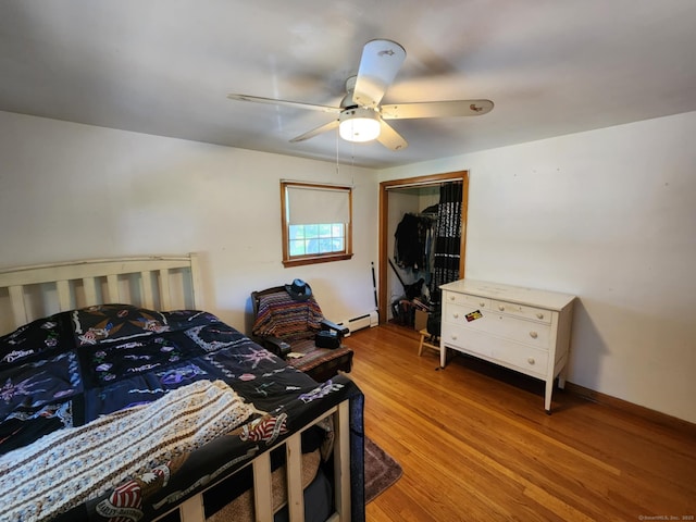 27 Payne Pl, Meriden, CT 06450 - bedroom featuring baseboard heating, light wood-type flooring, a ceiling fan, a closet, and baseboards