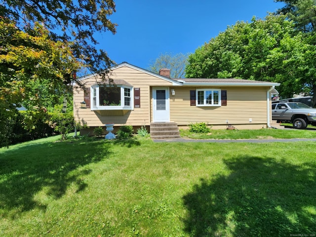27 Payne Pl, Meriden, CT 06450 - ranch-style house featuring a chimney, a front yard, and entry steps