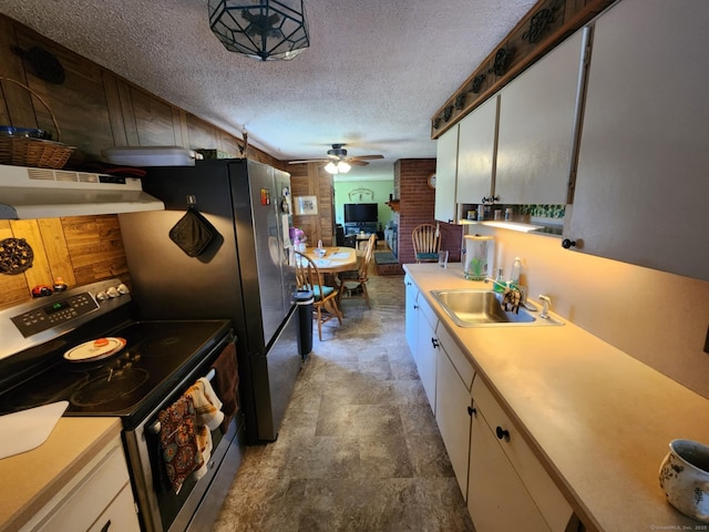 27 Payne Pl, Meriden, CT 06450 - kitchen featuring stainless steel electric stove, a sink, a ceiling fan, light countertops, and wood walls