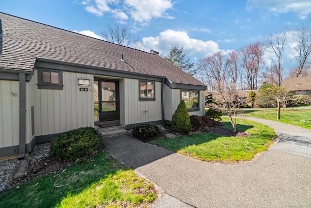 917 Heritage Vlg Unit B, Southbury, CT 06488 - doorway to property with a shingled roof and a yard