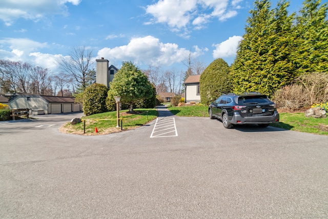 917 Heritage Vlg Unit B, Southbury, CT 06488 - view of vehicle parking featuring a garage