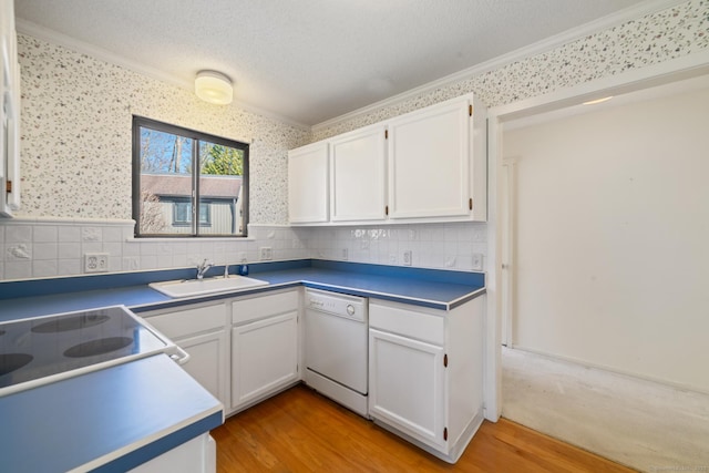917 Heritage Vlg Unit B, Southbury, CT 06488 - kitchen with a sink, crown molding, dishwasher, white cabinets, and light wood finished floors