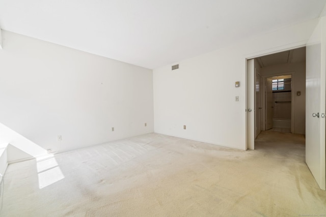 917 Heritage Vlg Unit B, Southbury, CT 06488 - unfurnished room featuring attic access and light carpet
