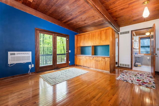 29 Lighthouse Rd, Woodbury, CT 06798 - unfurnished living room with wood ceiling, a wall unit AC, and wood-type flooring
