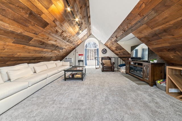 unfurnished living room featuring wood ceiling, carpet floors, and lofted ceiling