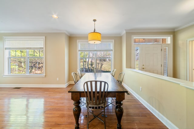 1 Winding Trl Unit 1, Middlebury, CT 06762 - dining room with wood finished floors, healthy amount of natural light, baseboards, and ornamental molding