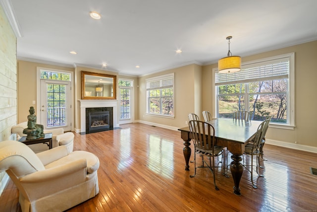 1 Winding Trl Unit 1, Middlebury, CT 06762 - dining room featuring a fireplace with flush hearth, hardwood / wood-style floors, crown molding, baseboards, and recessed lighting