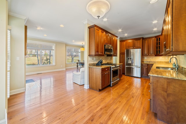 1 Winding Trl Unit 1, Middlebury, CT 06762 - kitchen with appliances with stainless steel finishes, a sink, crown molding, tasteful backsplash, and light wood-type flooring