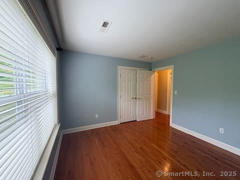1 Winding Trl Unit 1, Middlebury, CT 06762 - unfurnished bedroom with wood finished floors, baseboards, and a closet