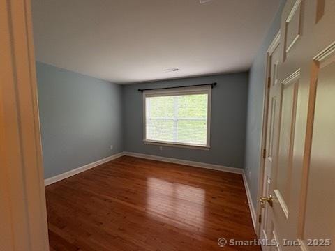 1 Winding Trl Unit 1, Middlebury, CT 06762 - empty room with wood finished floors and baseboards