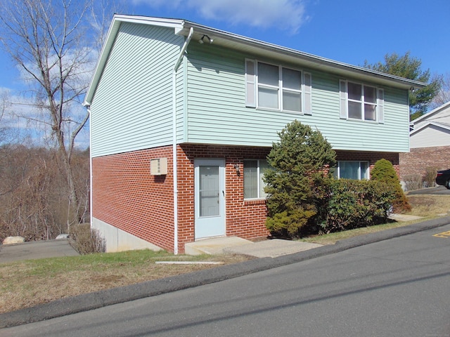 200 Yale St Unit 31B, Waterbury, CT 06704 - view of front of house featuring brick siding and a wall unit AC