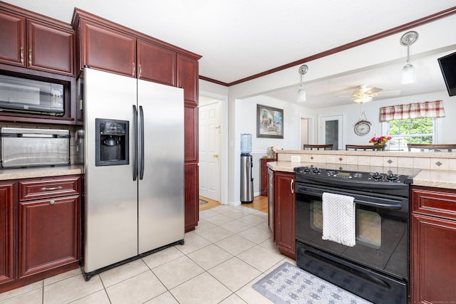 kitchen with dark brown cabinets, light countertops, light tile patterned floors, black appliances, and ornamental molding