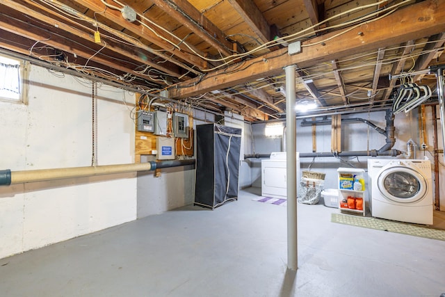 below grade area with separate washer and dryer and electric panel