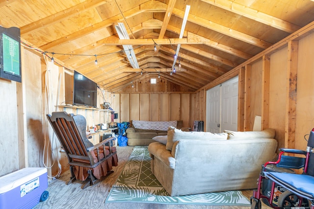 living area featuring wood finished floors and lofted ceiling