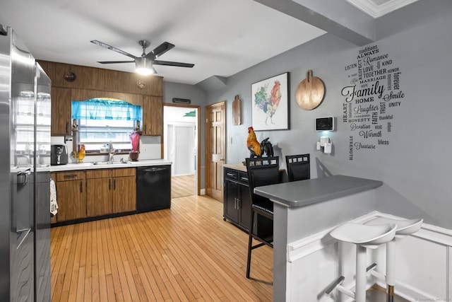 17 Winfield Dr, Stratford, CT 06615 - kitchen featuring black dishwasher, a sink, ceiling fan, light countertops, and stainless steel refrigerator with ice dispenser