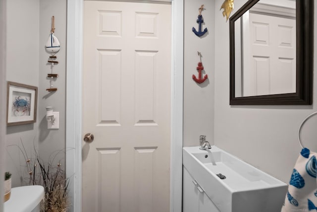 half bath with vanity and toilet