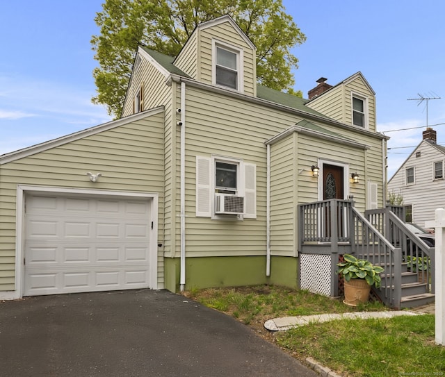 17 Winfield Dr, Stratford, CT 06615 - view of front of property with asphalt driveway, cooling unit, a garage, and a chimney