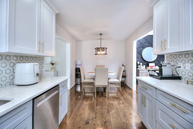 kitchen with dark wood-style flooring, an inviting chandelier, white cabinetry, decorative backsplash, and stainless steel dishwasher